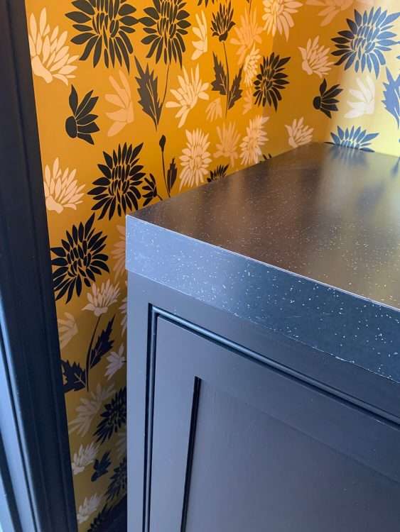 Black SparkleLam™ on the countertop of a powder room in a private residence.