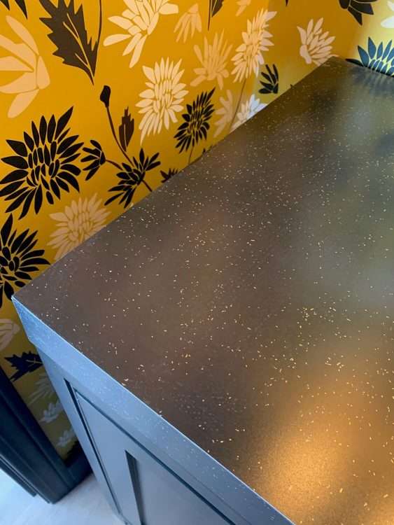 Black SparkleLam™ on the countertop of a powder room in a private residence.