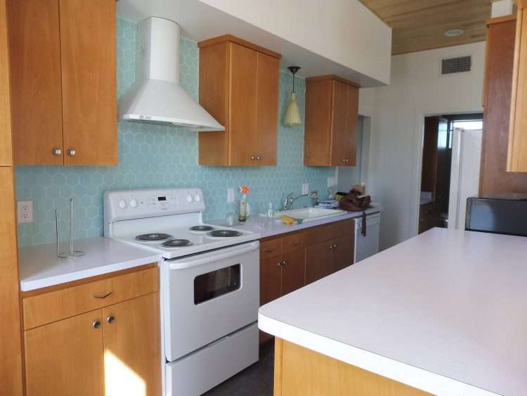 White SparkleLam™ countertops in a fresh, vintage remodel of a private residence.