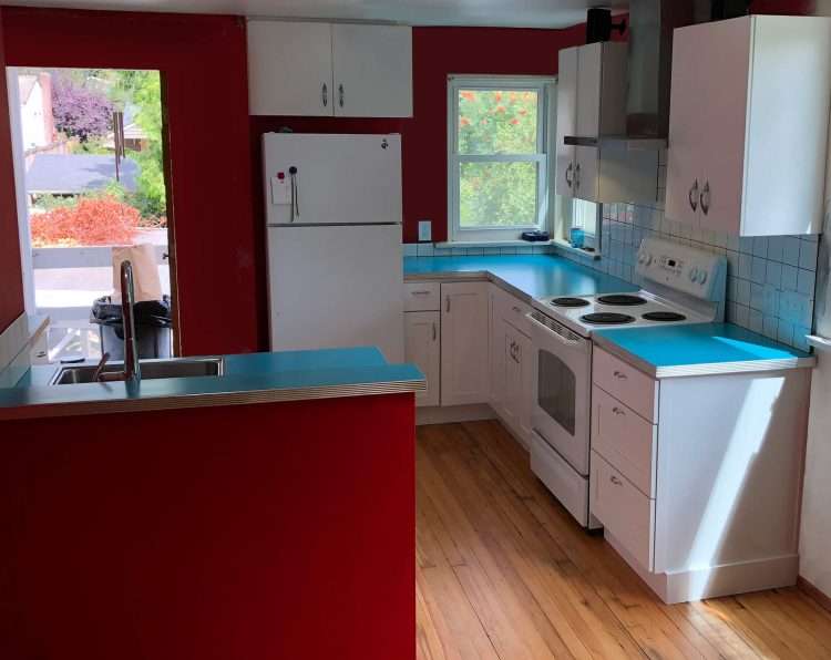 Dark aqua SparkleLam™ countertops in a private residence.