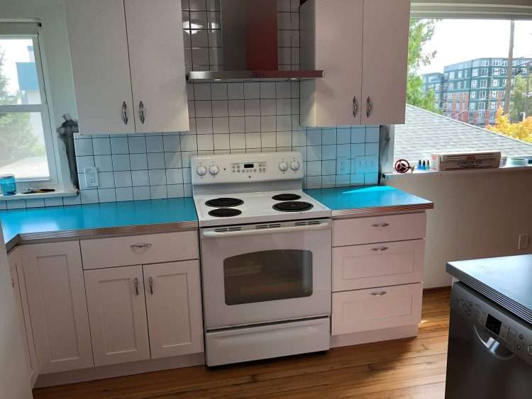 Dark aqua SparkleLam™ countertops in a private residence.