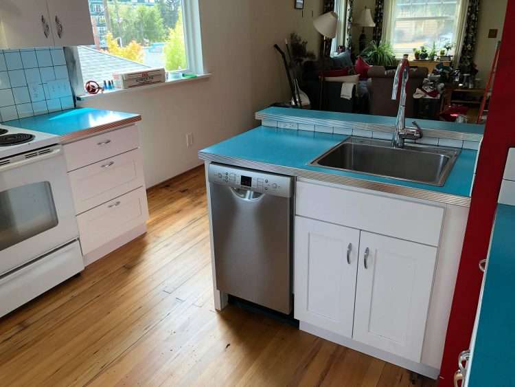 Dark aqua SparkleLam™ countertops in a private residence.
