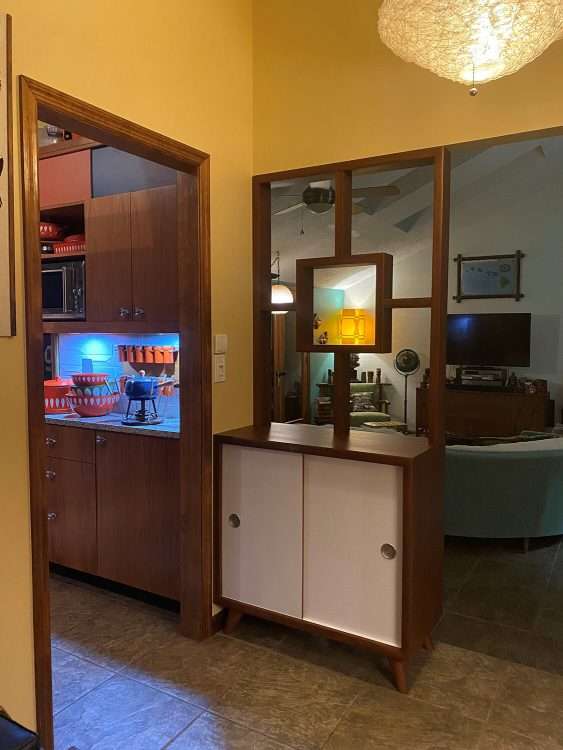 Custom cabinet in a private residence. The sliding doors of the cabinet are made with white SparkleLam™.
