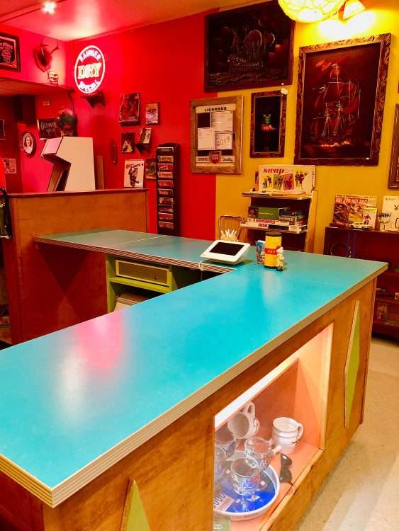From a bar and vintage store in Seattle. Countertops in Dark Aqua SparkleLam™.