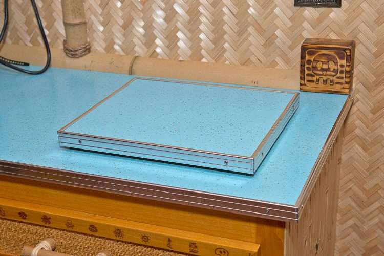 Tiki bar in a private home made by the homeowner. Board for use with a Lewis bag and countertops made with Light Aqua SparkleLam™.