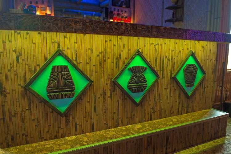 Tiki bar in a private home made by the homeowner. The masks are backlit and mounted on Light Aqua SparkleLam™.